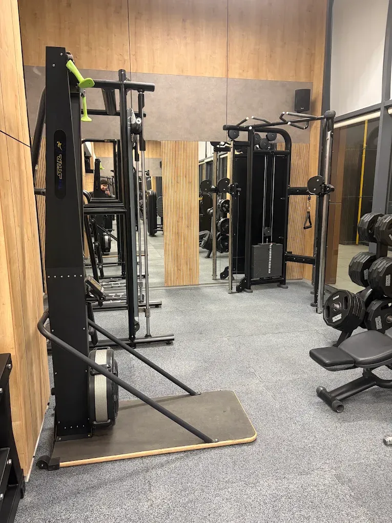 Urban Fitness Club – completed strength zone with cable machines and mirror walls